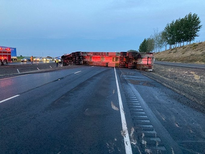 A stretch of I-90 north of Warden was closed Thursday morning when a westbound semi-tractor trailer flipped over.