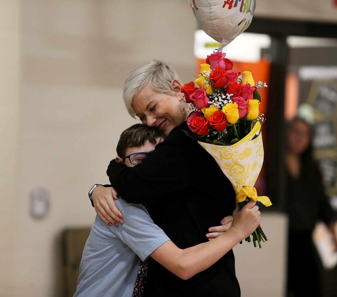Clark Massey gives his mom Karen Lauritzen a big hug Thursday morning after it was announced she is the 2023 Idaho Teacher of the Year.