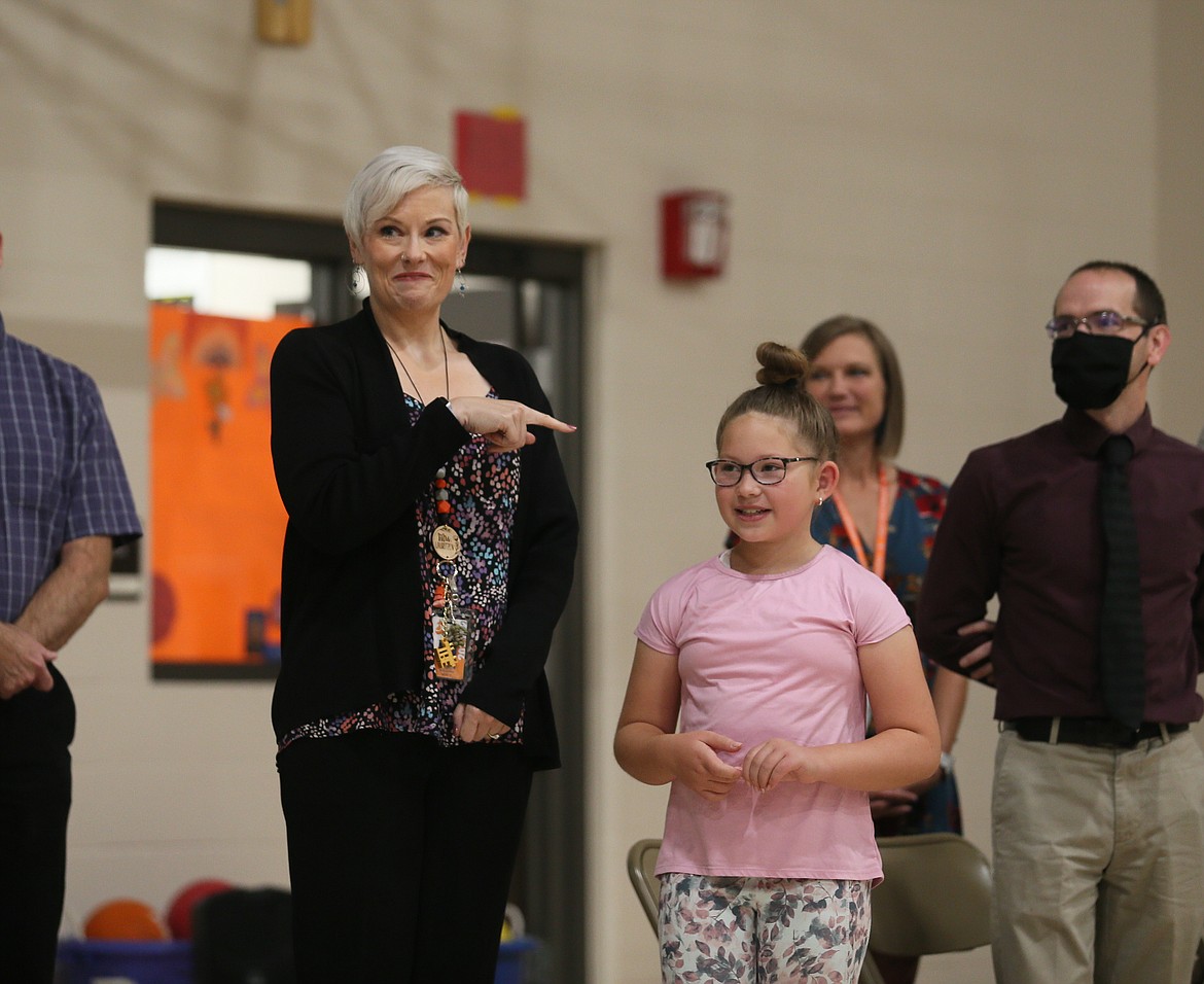 Idaho Teacher of the Year for 2023 Karen Lauritzen playfully points to student Paisley Roberts as Paisley's letter nominating Lauritzen is read by Superintendent of Public Instruction Sherri Ybarra in the Treaty Rock gym Thursday morning.