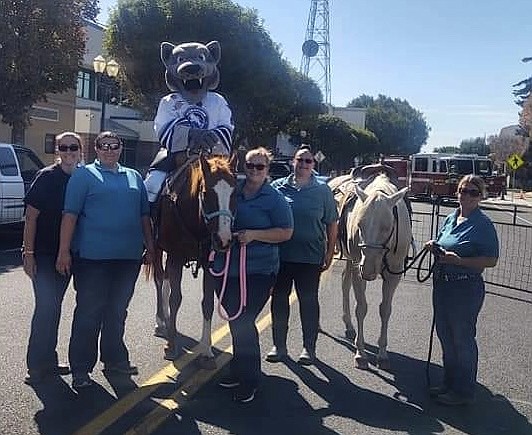 The Wenatchee Wild’s Walt the Wolf mounted up with the Grant County Sheriff’s Posse Wednesday at the Autism Awareness Walk in Ephrata Saturday. The event, hosted by the Autism Support Group of Grant County, included food trucks and a bounce house as well as a walk up Beezley Hill. From left: Breanna Wahl, Shelby Carter, Walt, Trisha Cox, Anne Carter and Ingrid Olsen.