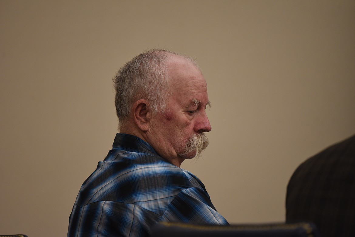 Eugene George Hallas sits at the defendant's table during his Sept. 29 arraignment on an assault with a weapon charge in Flathead County District Court. (Derrick Perkins/Daily Inter Lake)