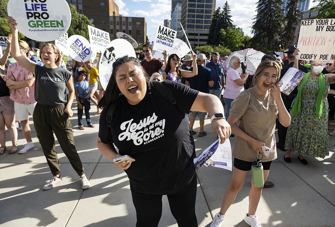 Rebeca Castro, of Fruitland, sings and dances to a Christian praise song during an anti-abortion celebration for the overturn of Roe v. Wade, held outside of the Idaho Statehouse in Boise, Idaho on June 28, 2022. (Sarah A. Miller/Idaho Statesman via AP, File)