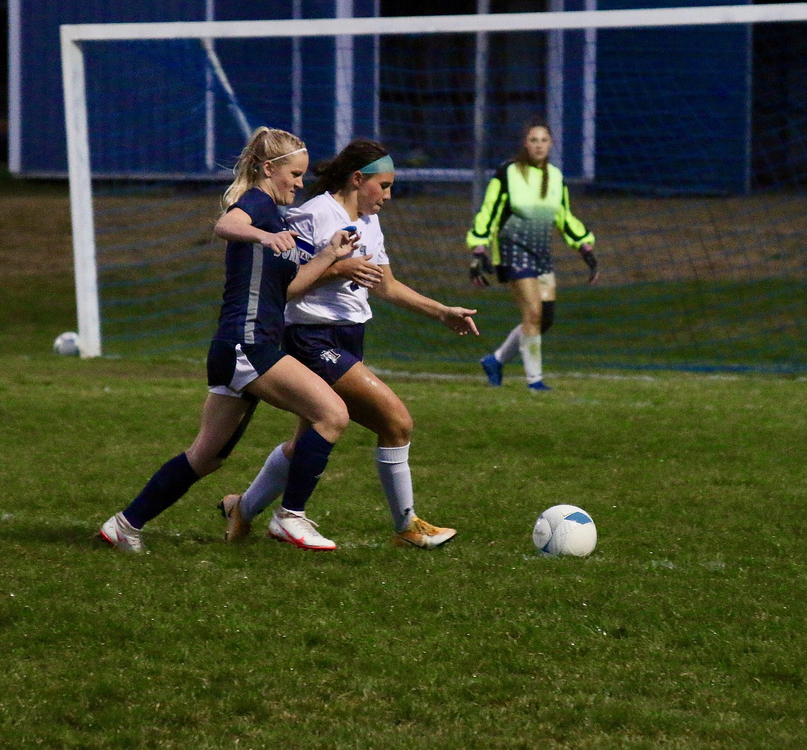 #1 Macy McIntyre fights a Timberlake defender for the ball.