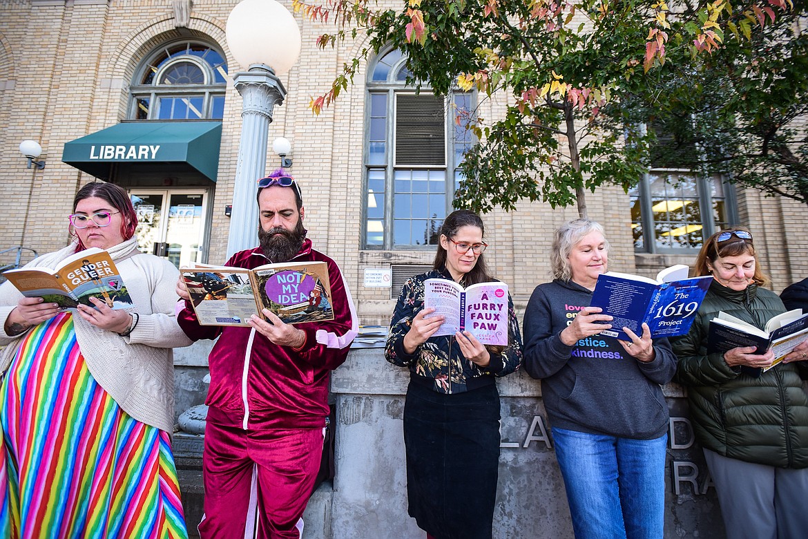 Supporters of the public library system and Love Lives Here in the Flathead Valley hold a read-in to highlight censorship issues and promote recently-challenged books outside ImagineIF Library in Kalispell on Saturday, Oct. 1. (Casey Kreider/Daily Inter Lake)