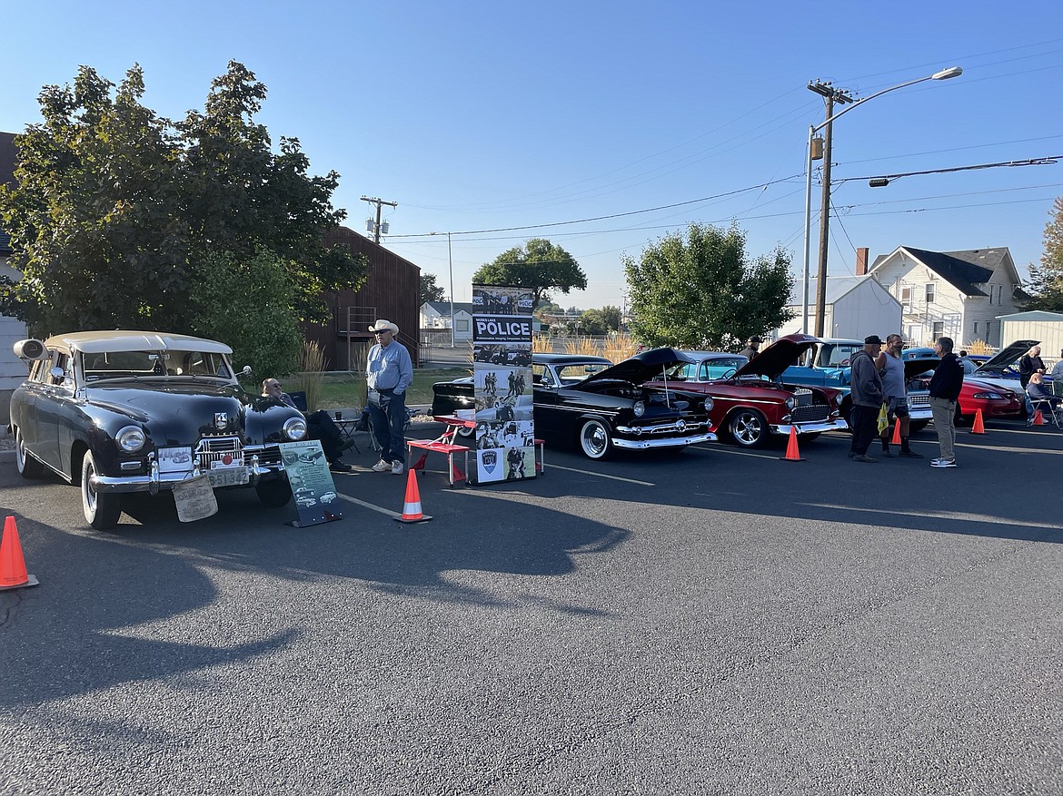 Classic cars on display in the Moses Lake Civic Center parking lot during the Moses Lake Police Department's Cops, Cars and Coffee fundraiser Saturday morning.