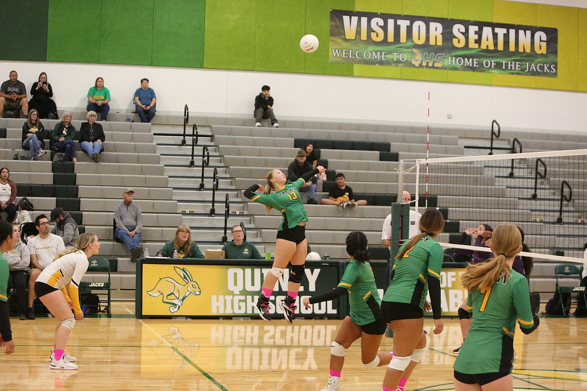 Quincy freshman Jaydin Nellis leaps in the air to return a volley to the Mabton side of the court during the Jacks’ 3-1 win over the Vikings on Saturday.