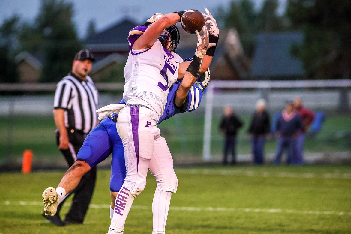 Polson junior Logan Smith makes an interception against the Wildcats in Columbia Falls on Friday. (JP Edge/Hungry Horse News)