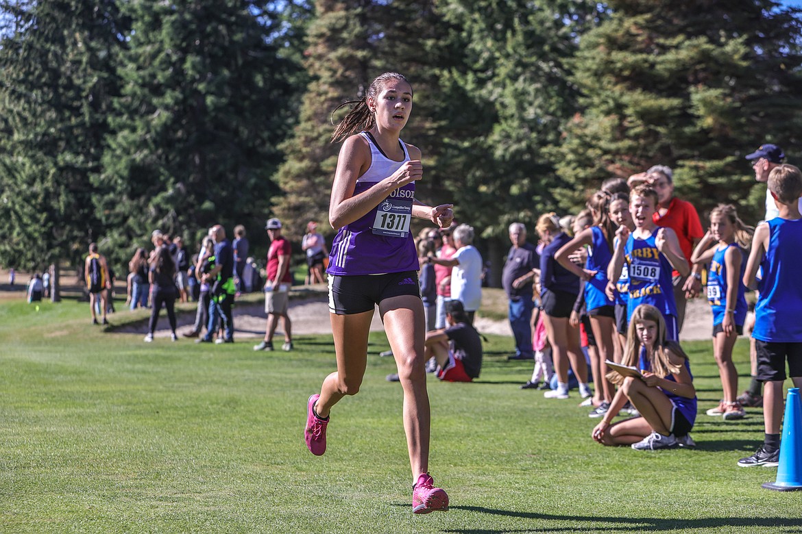 Polson's Ashtyn Wagner crosses the finish line at Whitefish Lake Golf Course on Tuesday Sept. 27. (JP Edge/Hungry Horse News)