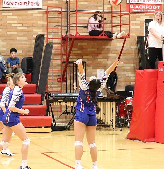Superior's Lanie Crabb, back to camera, during the Lady Bobcats five-set match against Noxon last week. (Photo by Kami Milender)