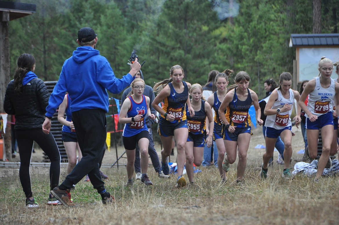 Runners depart from the starting line of the Libby Wilderness cross country run this past Saturday on a cool, fall day for running. (Photo by Sarah Naegeli)
