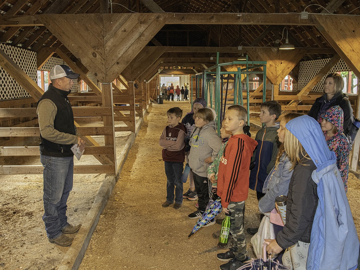 John Marrinan from the Western Montana Cattleman's Association in Hot Springs talks with students about beef production. (Tracy Scott/Valley Press)
