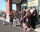 Slices Brick Oven House owners cut ribbon