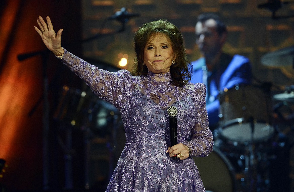 Loretta Lynn waves to the crowd after performing during the Americana Music Honors and Awards show Wednesday, Sept. 17, 2014, in Nashville, Tenn. Lynn, the Kentucky coal miner’s daughter who became a pillar of country music, died Tuesday at her home in Hurricane Mills, Tenn. She was 90. (AP Photo/Mark Zaleski, File)