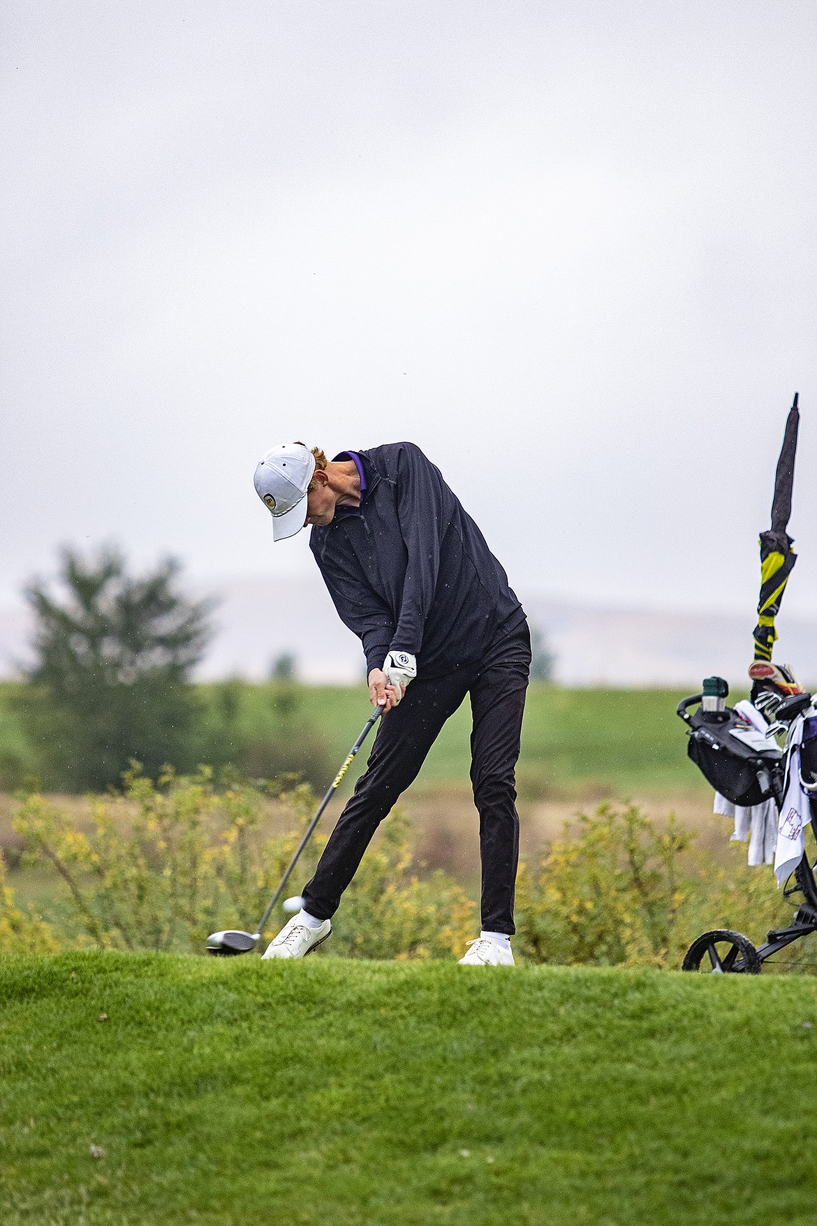 Polson Pirate Carson Hupka fires a shot down the #18 fairway during the 2022 Class A State Championship. (Lake County Leader file photo)