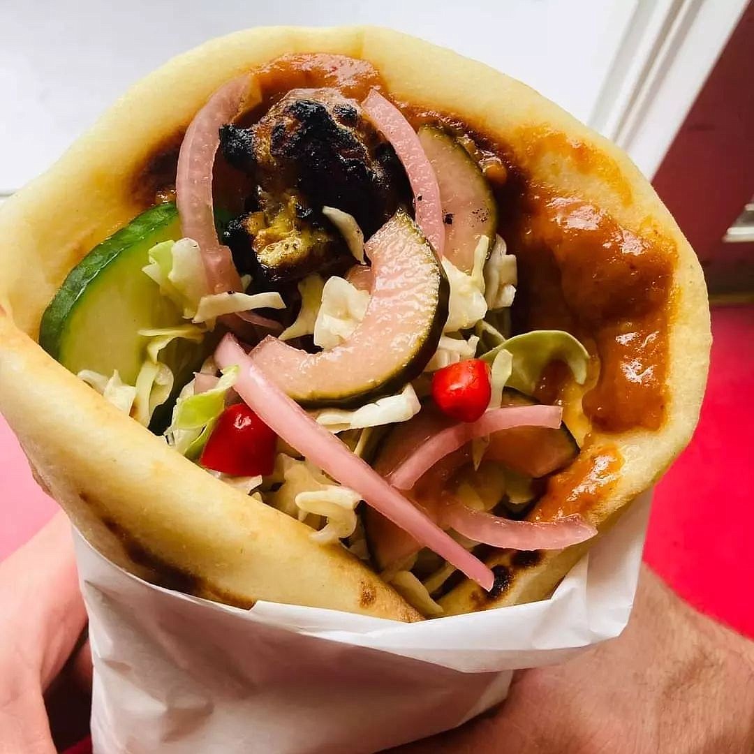 Isling Chow's Thai chicken wrap, which includes grilled marinated chicken satay, home made peanut sauce, sliced cucumber, nan pla prik, Japanese slaw all wrapped in grilled Indian naan. (photo provided)