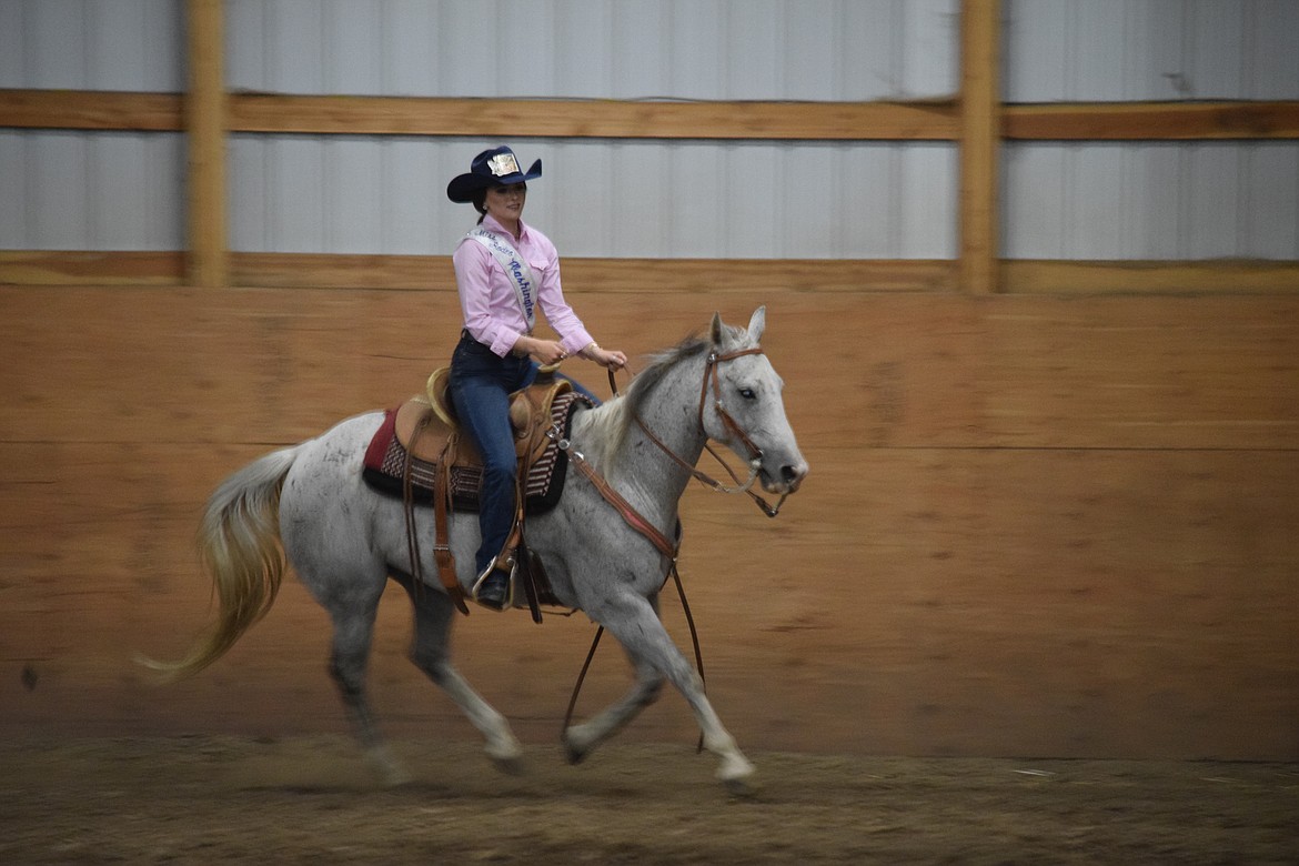 Miss Rodeo Washington Lexy Hibbs puts Badger, owned by Iron Legacy Ranch hand JoJo Ewing, through his paces as she rides a two-minute pattern as part of the upcoming Miss Rodeo America contest in November.