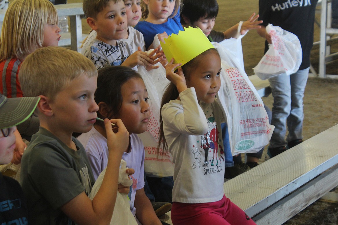 A first-grader puts on the crown she won with her honeybee knowledge at First Grade Farm Day, a longtime project of the Moses Lake High School FFA chapter, along with agriculture and science classes.