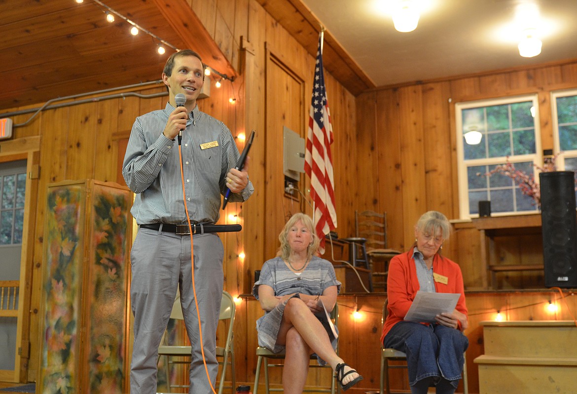 Sterling Laudon, candidate for House District 12, adds his voice to Monday's legislative forum, while Shirley Azzopardi and Jill Read (sitting in for Linda Reksten) await their turns. (Kristi Niemeyer/Lake County Leader)