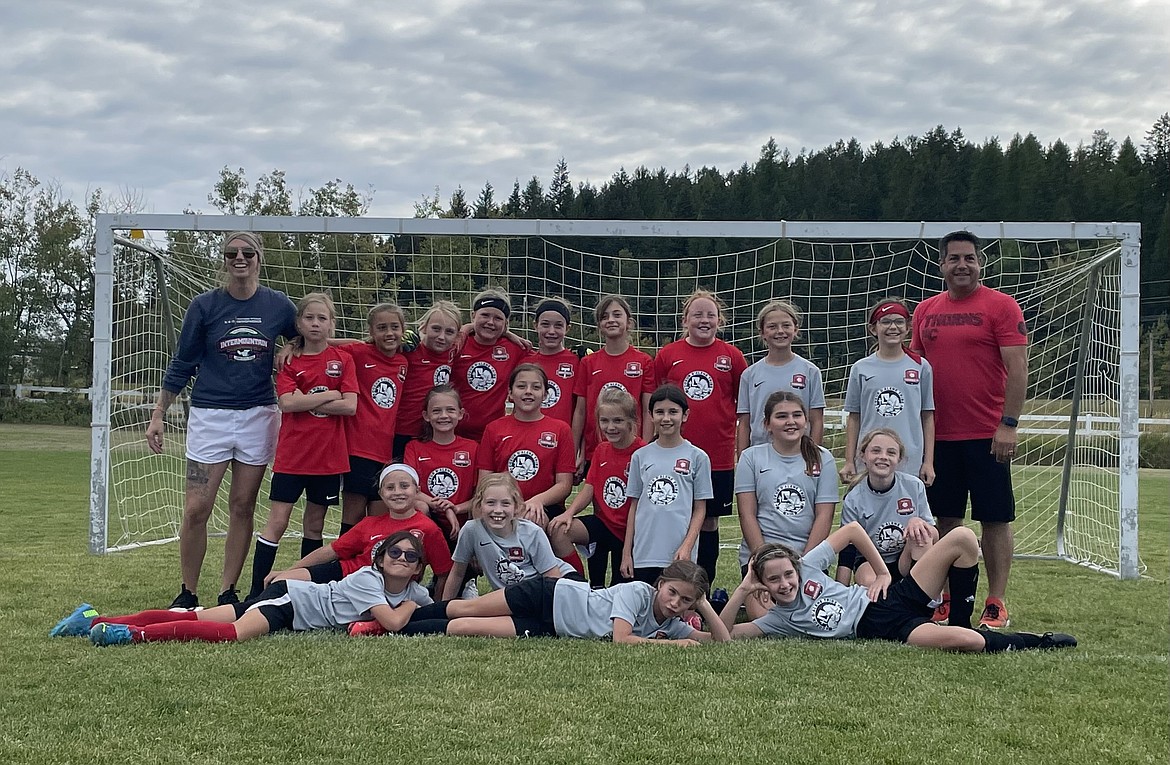 Photo by MELISSA QUINN
The Thorns North FC 12 Girls soccer team took second place in the Glacier Surf Premier Cup Tournament in Whitefish, Mont., last weekend. The '12 Thorns played as two teams (green and yellow). They played against Missoula Surf, Helena HYSA, and EW Surf. In the front row from left are Isabella Baker, Myah Lindquist, Ariana Leferink, Tia Frank and Ocoee Kaplan; middle row from left, Hannah Burkwist, Rori Coates, Ella Herzog, Emie Anain, Raegan Fish and Sara Fischer; and back row from left, coach Ricki Stone, Adelyn Horsley, Chloe Quinn, Allie Stone, Sienna Buffum, Tessa Schmidt, Eloise Mandel, Mary Kate Doree, Zoey Johnson, Delaney Morrisroe and coach Josh Baker.