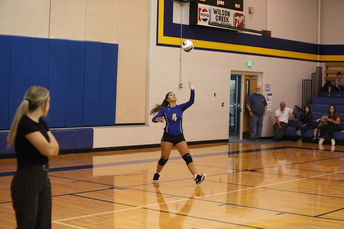 Wilson Creek junior Lucy Cioccolini tosses the ball in the air in preparation to serve for the Devils.