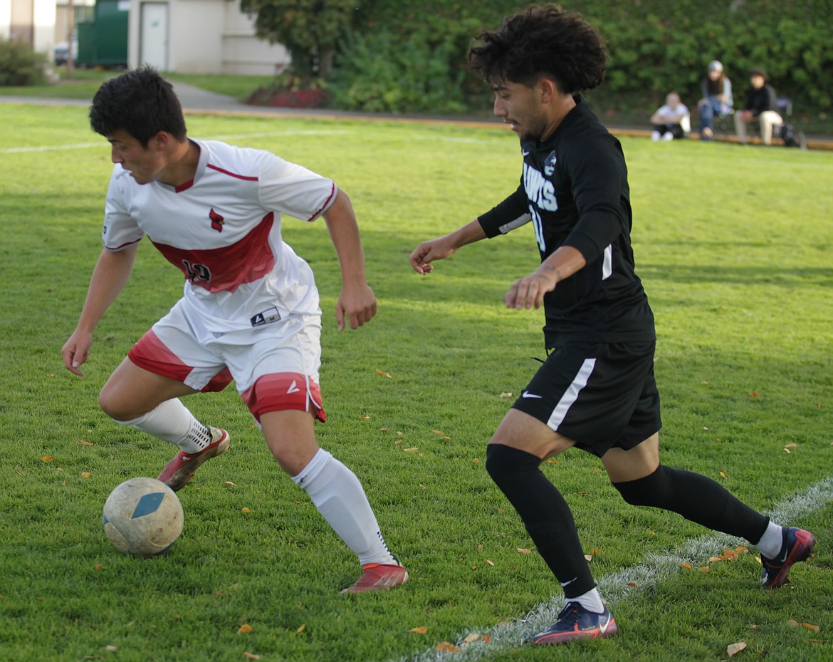 JASON ELLIOTT/Press
North Idaho College sophomore defender Aidan O'Halloran, a Post Falls High product, plays a ball away from the defense of Columbia Basin's Johnny Ramirez during the first half of Wednesday's match.