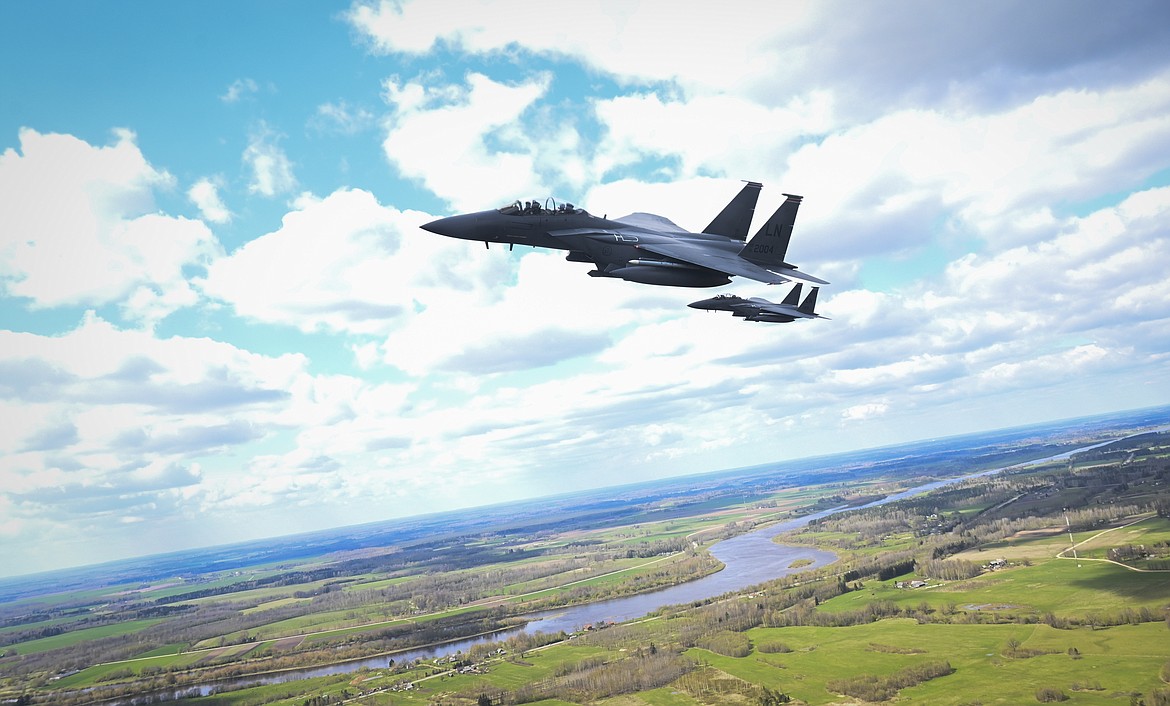 U.S. Air Force F-15E Strike Eagle aircraft assigned to the 48th Fighter Wing, fly next to a KC-135 Stratotanker aircraft from the 100th Air Refueling Wing, before a flyover above Latvia, May 4, 2021. Two Strike Eagles based in Idaho will perform a flyover of Bigfork's Homecoming celebrations on Friday. (U.S. Air Force photo by Tech. Sgt. Emerson Nuñez)