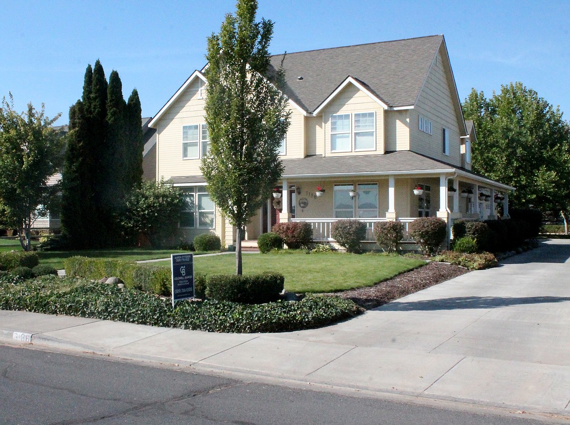 A home for sale in Moses Lake. Prices statewide are dropping, experts say, but for the time being they’re holding steady in the Basin.