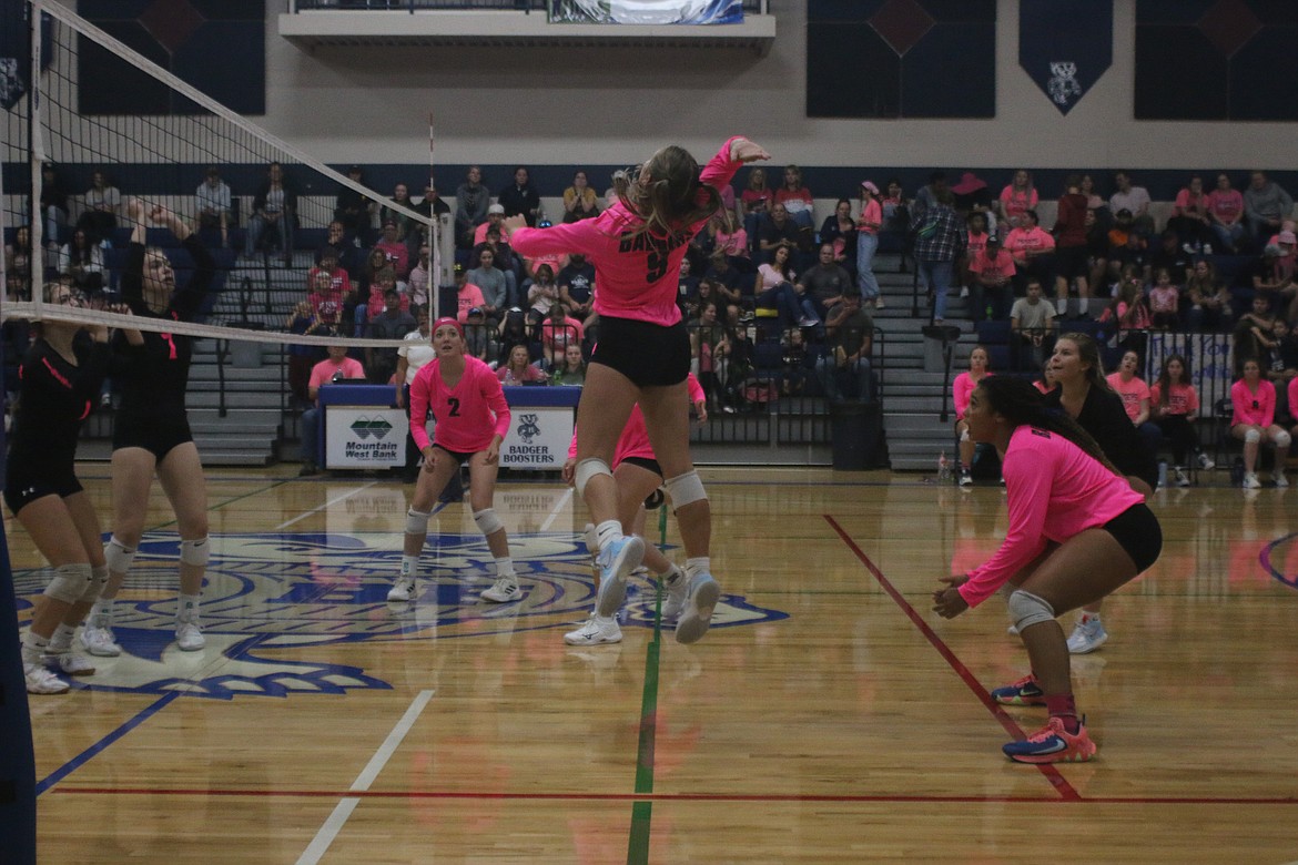 Braylyn Bayer spikes the ball against Timberlake.