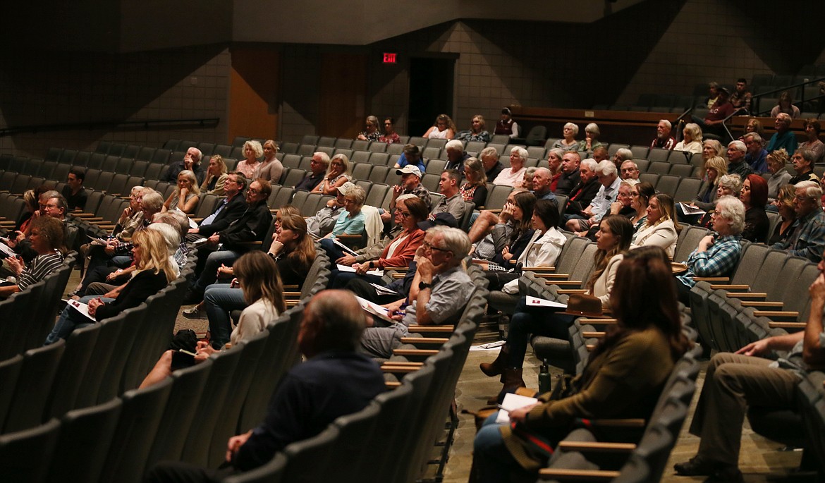 Guests listen to North Idaho College trustee candidates speak during a forum in the Schuler Performing Arts Center on the NIC campus Wednesday evening.