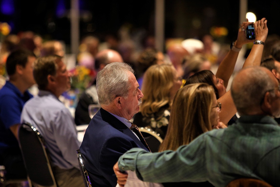 Mayor Jim Hammond, center, listens during the 26th annual Mayor's Awards in the Arts at the Hagadone Event Center on Wednesday.