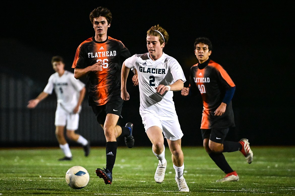 Glacier's Harrison Sanders (2) pushes the ball upfield in the first half against Flathead at Legends Stadium on Thursday, Oct. 6. (Casey Kreider/Daily Inter Lake)