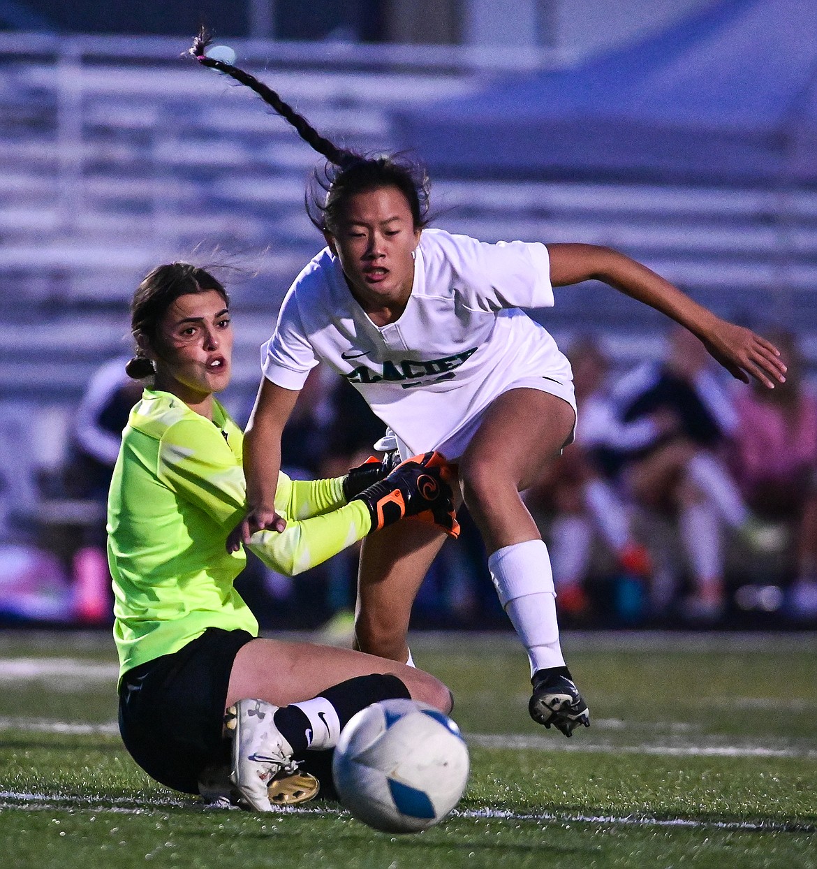 Glacier's Karys Camp (15) collides with Flathead goalkeeper Joy Sund in the second half at Legends Stadium on Thursday, Oct. 6. (Casey Kreider/Daily Inter Lake)