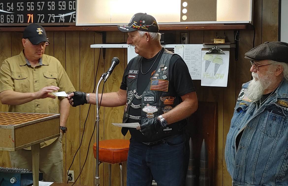 Bikers Don Byrd and Bill Needham present VFW Post 1675 Commander Chris Marker with a check for $1,400 following the recent "Serving our Soldiers Mountain Ride."
