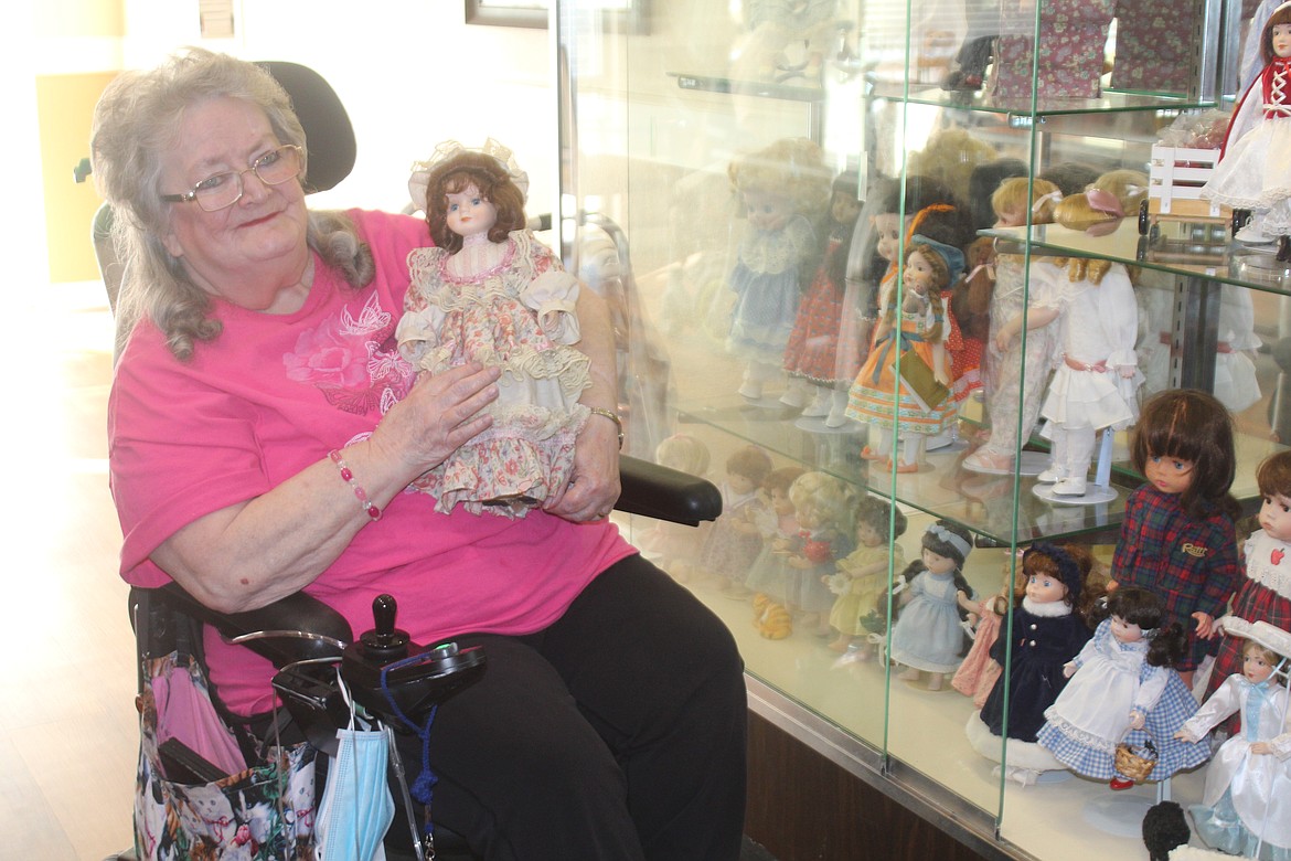 Bonnie Kahananui, Miss Bon Bon, with one of the dolls donated by the family of a former nurse at Brookdale Hearthstone Moses Lake. Delphi Bifano was a dedicated doll collector.