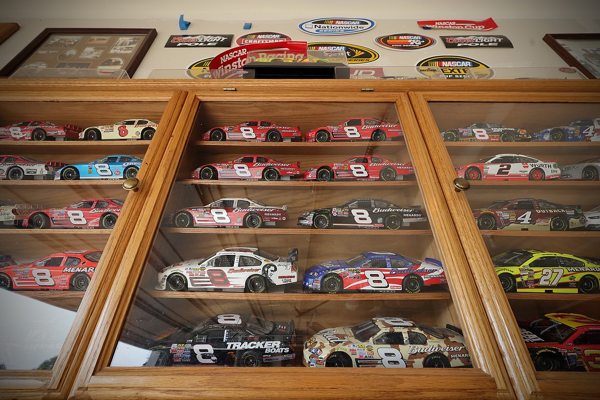 A display case of miniature NASCAR race cars, many of them signed, are just a small part of Kevin Bach's collection. (Jeremy Weber/Daily Inter Lake)