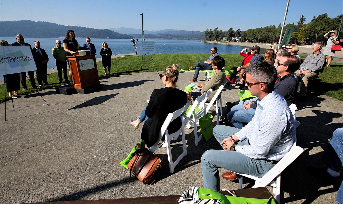 People listen to Amber Gunn, lead policy analyst with Mountain States Policy Center, during the organization's kickoff event at Independence Point on Thursday.