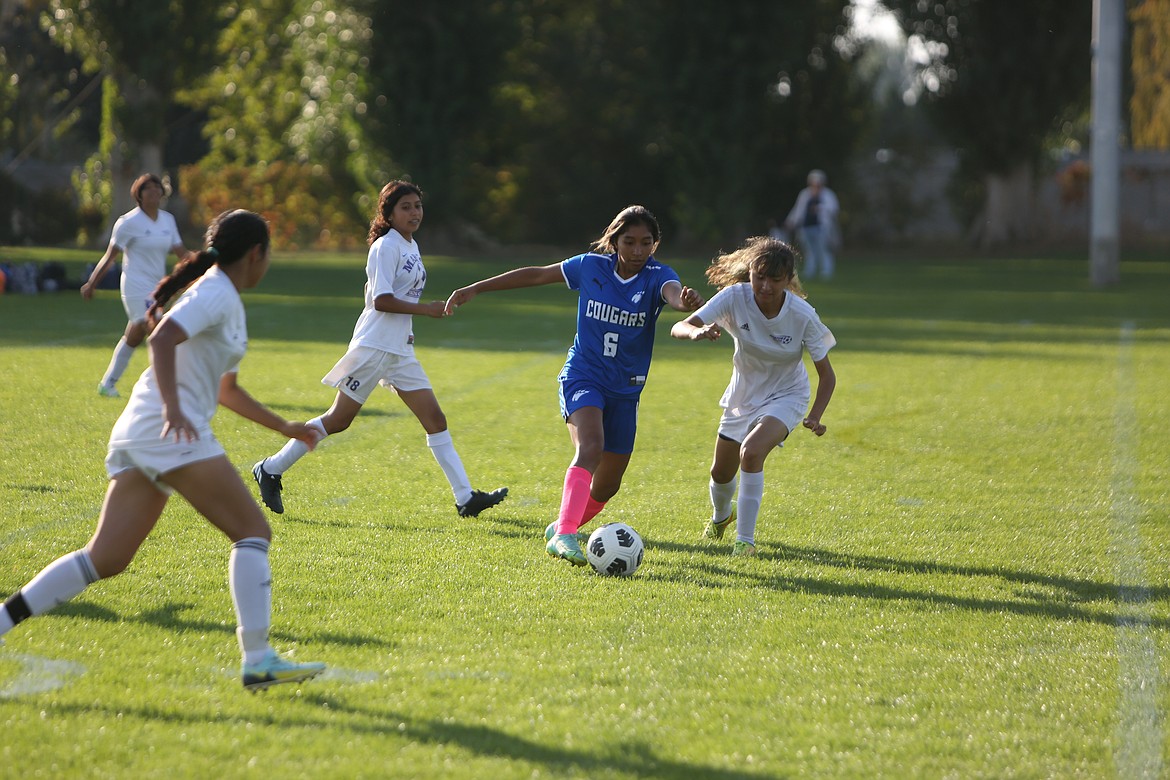 Warden’s Maira Zaragoza fights to get past a Mabton defender in the Cougars’ match against the Vikings on Thursday evening. While the Cougars fought hard to take home the W, the Vikings managed to stay ahead.