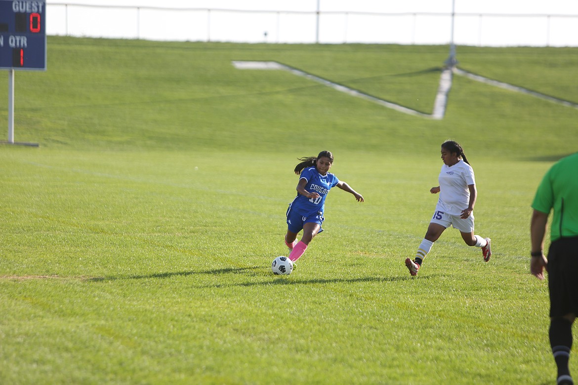 Warden sophomore Magaly Rangel looks to pass the ball to a teammate in the Cougars’ match against Mabton.