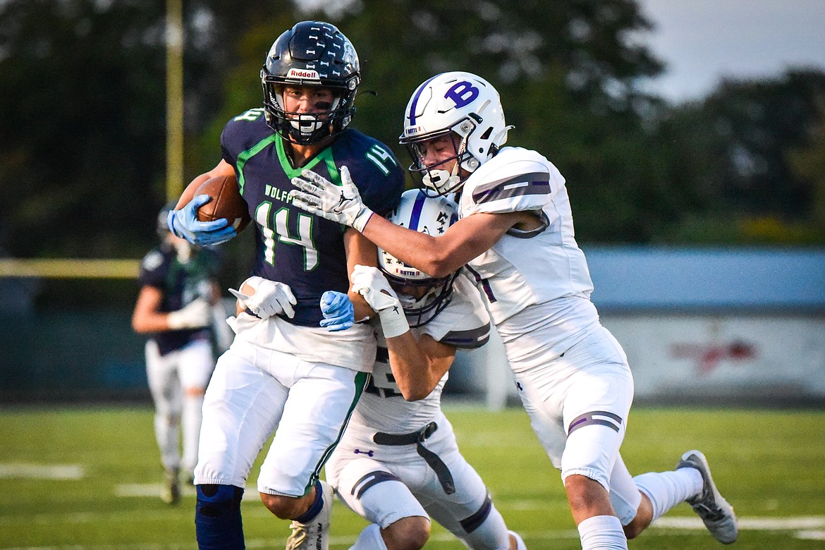 Glacier wide receiver Kaid Buls (14) is brought down after a 35-yard reception in the first quarter against Butte at Legends Stadium on Friday, Oct. 7. (Casey Kreider/Daily Inter Lake)