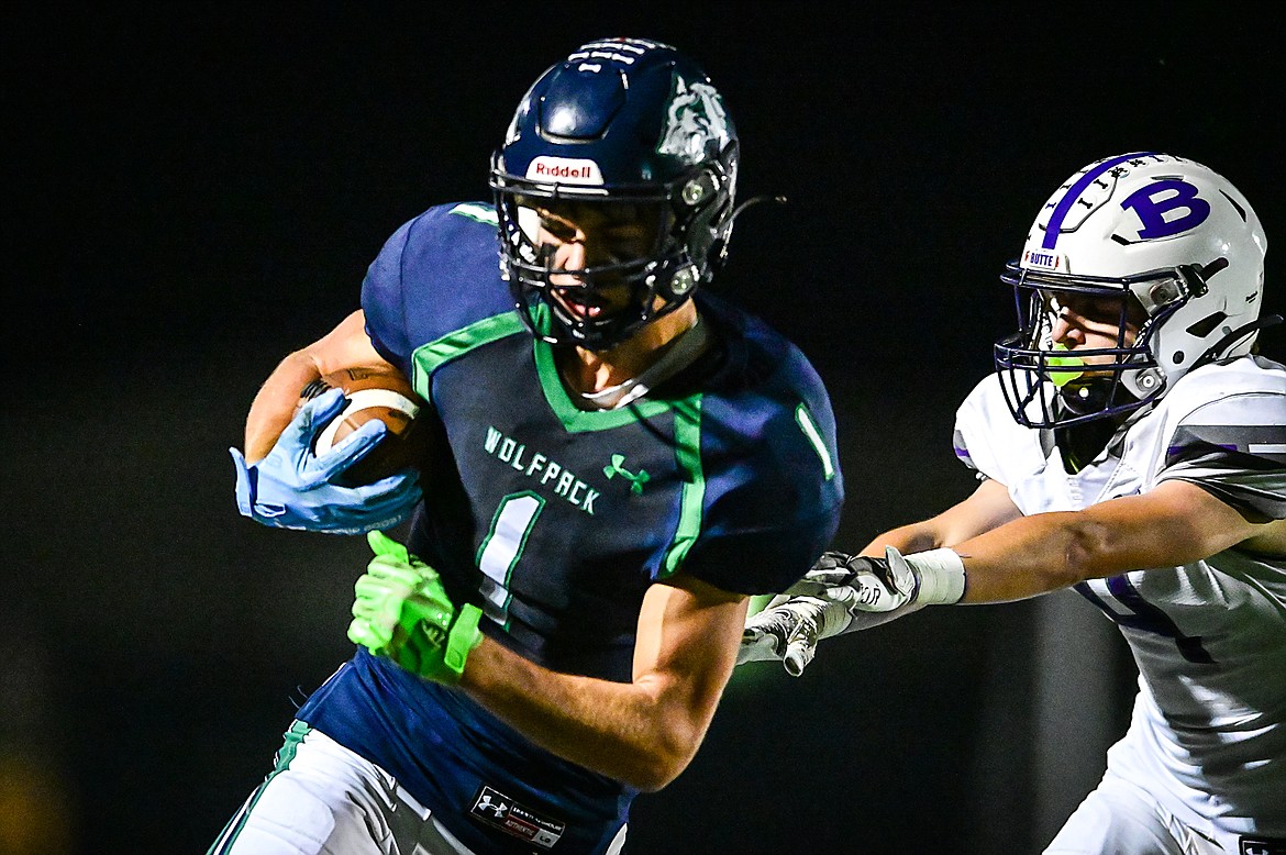 Glacier wide receiver Cohen Kastelitz (1) picks up yardage after a reception in the third quarter against Butte at Legends Stadium on Friday, Oct. 7. (Casey Kreider/Daily Inter Lake)