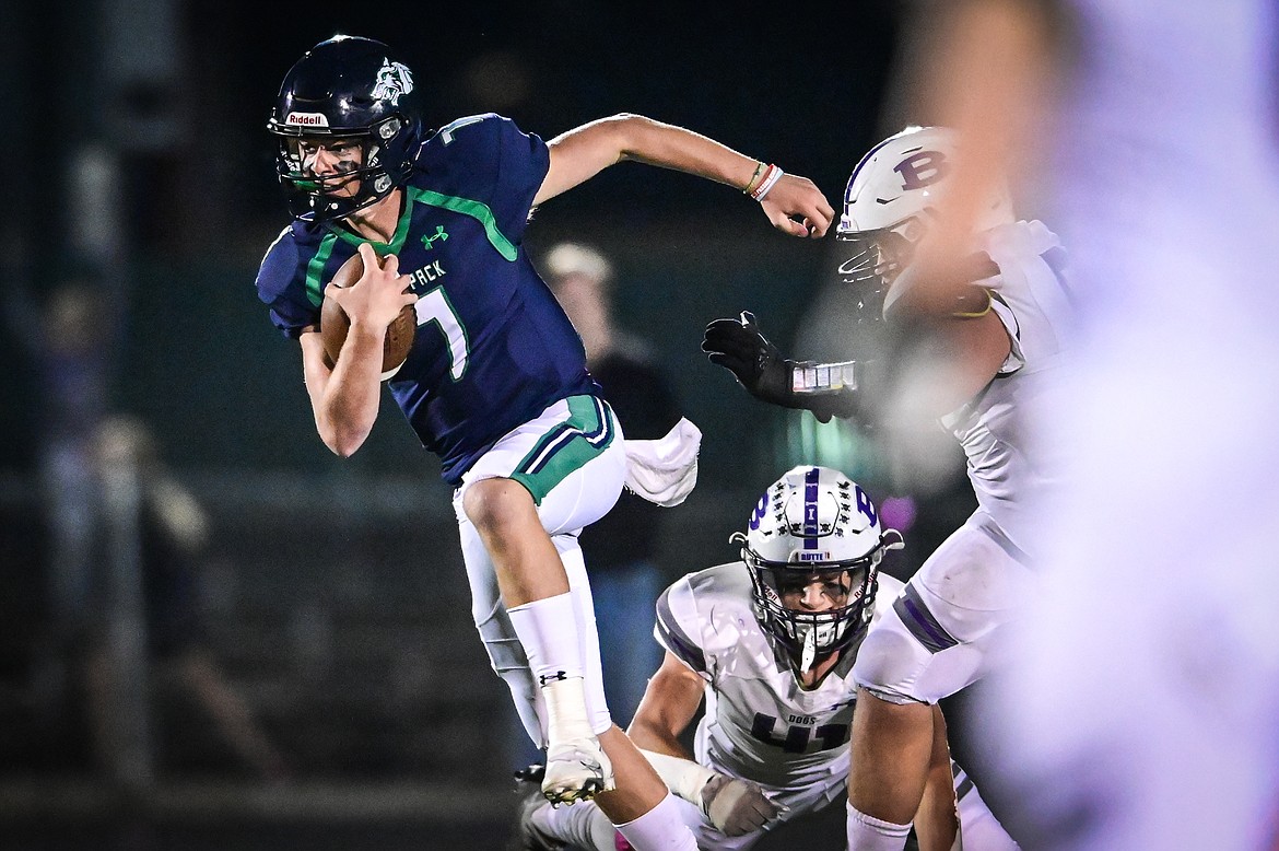 Glacier quarterback Gage Sliter (7) scrambles for a gain in the second half against Butte at Legends Stadium on Friday, Oct. 7. (Casey Kreider/Daily Inter Lake)