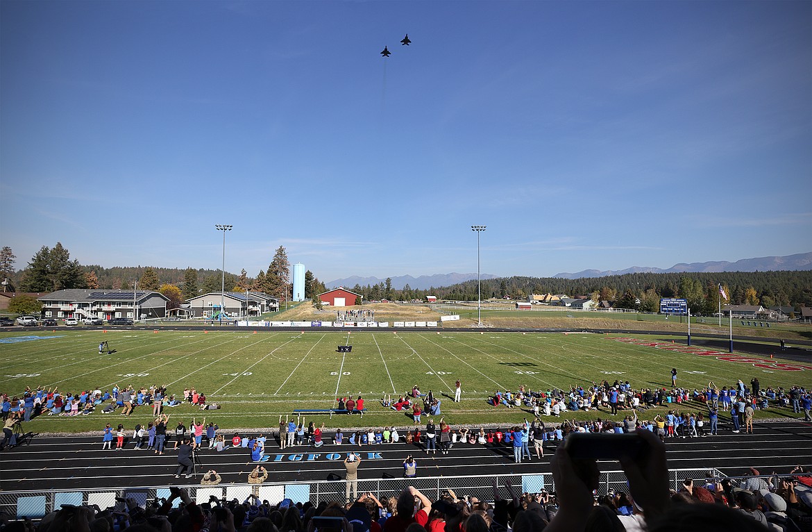 A pair of F-15E Strike Eagles from Mountain Home Air Force Base in Idaho perform a flyover of Bigfork High School's football field Friday as part of the school's Homecoming celebrations. (Jeremy Weber/Daily Inter Lake)