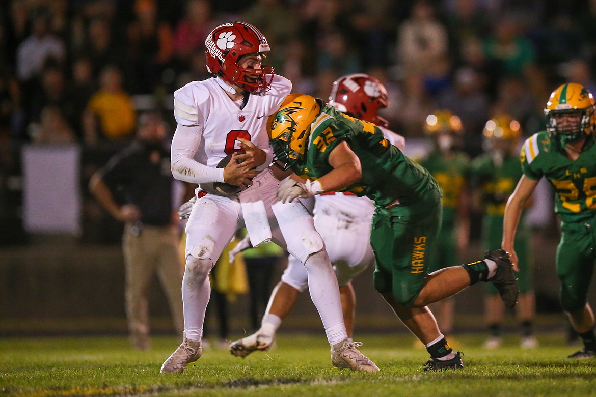 JASON DUCHOW PHOTOGRAPHY
Chase Burcham of Lakeland tackles Sandpoint quarterback Parker Pettit on Friday night in Rathdrum.