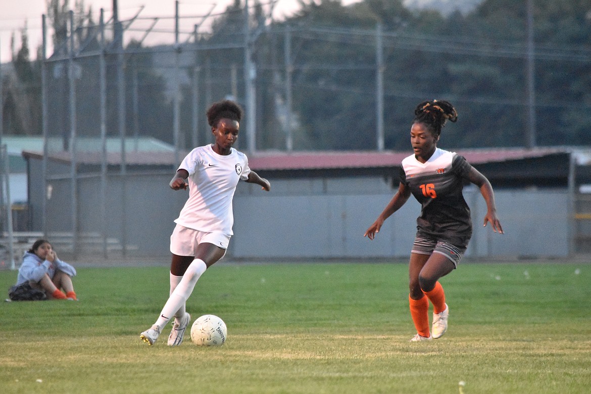 Ephrata defender Anna Raine (16) keeps close to her opponent during the conference matchup against Selah.