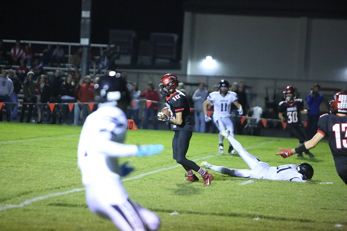 Brocno sophomore Jayce Kelly (10) intercepts his first of three passes on the night, returning this one for 31 yards.