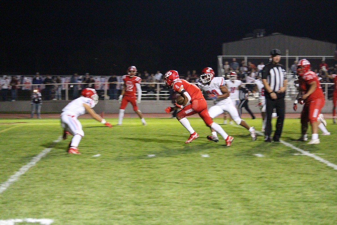 Sonny Asu (4) heads for the end zone for Othello’s first touchdown in the team’s win over Prosser Friday.