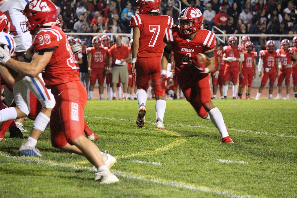 Sonny Asu (4) turns upfield in Othello’s 28-17 win over Prosser Friday.