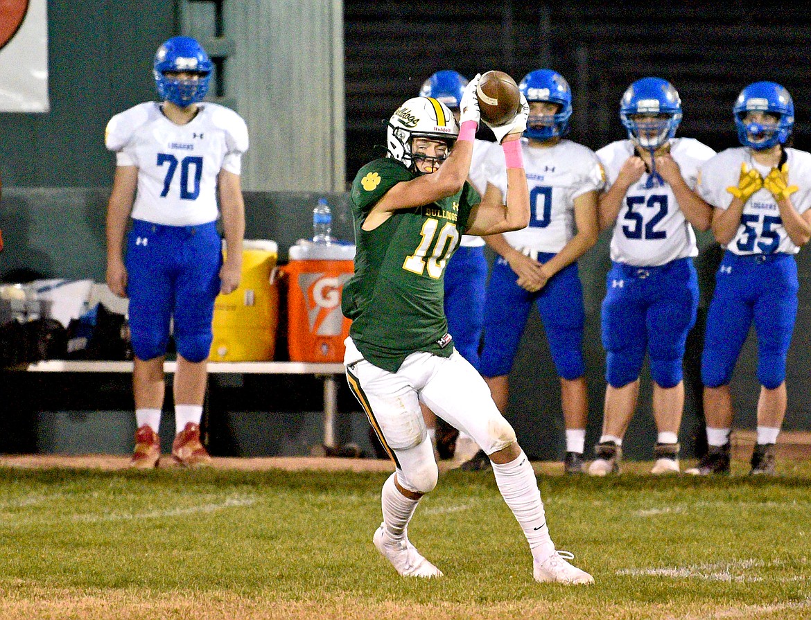 Whitefish's Mason Kelch catches a pass that helps Whitefish to a first down in a game against Libby on Friday at the Dawg Pound. (Whitney England/Whitefish Pilot)