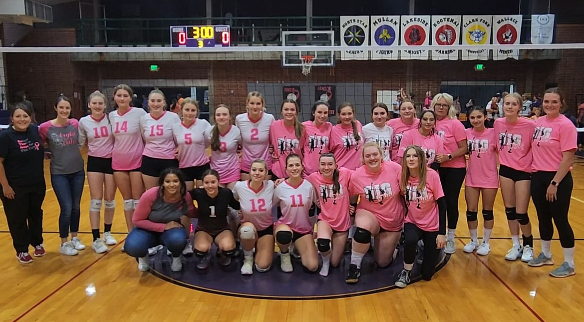 Members of the Wallace and Mullan Volleyball teams during Mullan's Dig Pink Night.