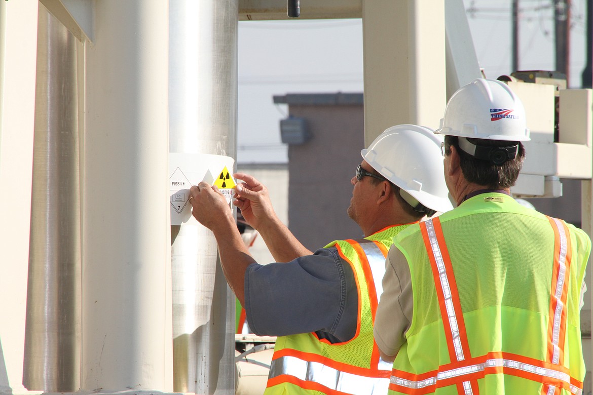 Workers prepare the shipment of highly radioactive sludge for movement to the center of the Hanford Site. Cleanup efforts at Hanford include a new tool to solidify waste.